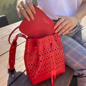 Red leather bucket bag with cutout details